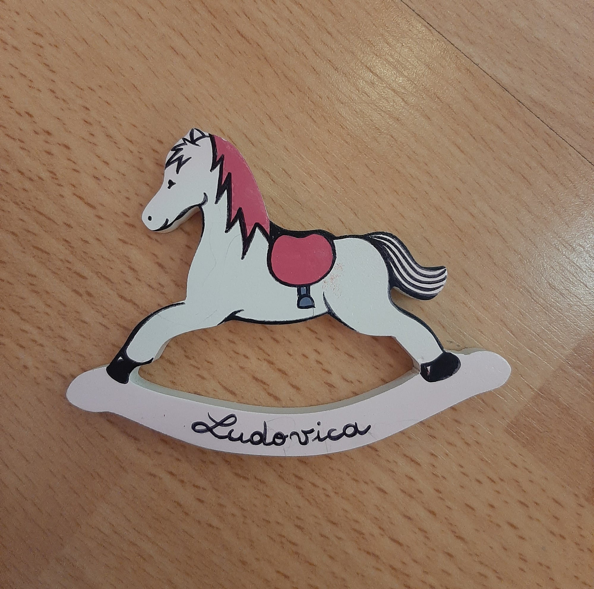 Bomboniere "cavalluccio a dondolo rosa "
